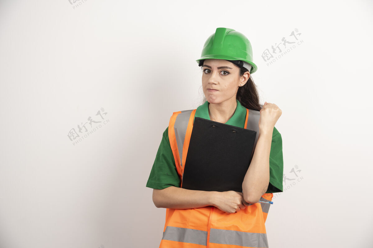 主管成功的女建造师戴头盔和安全橙色背心的肖像高质量的照片工人工程师职业