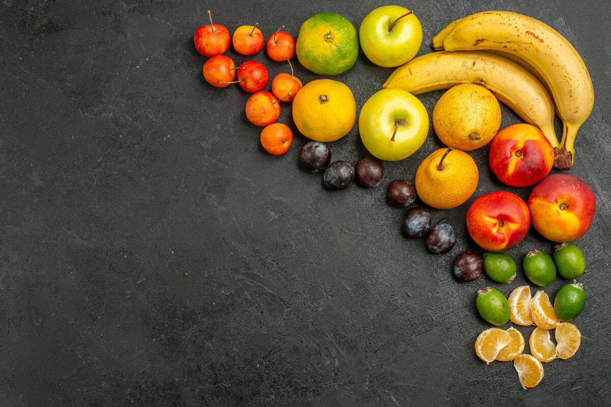 柠檬顶视图水果组成新鲜水果的灰色背景水果成分苹果饮食